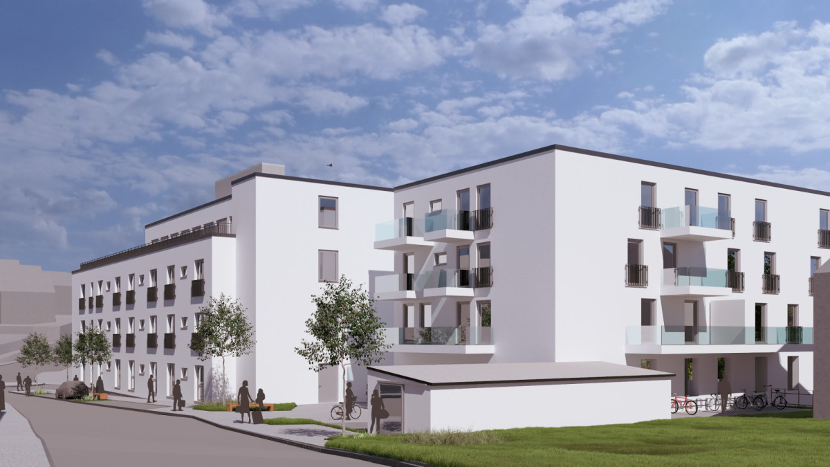 Ein wei&szlig;es Geb&auml;ude mit Flachdach in L-Form